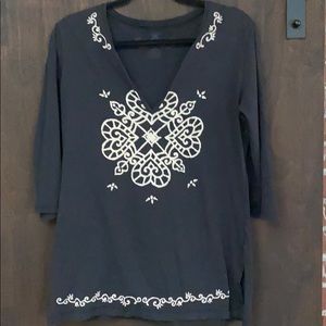 Very light yoga shirt fits as a medium.